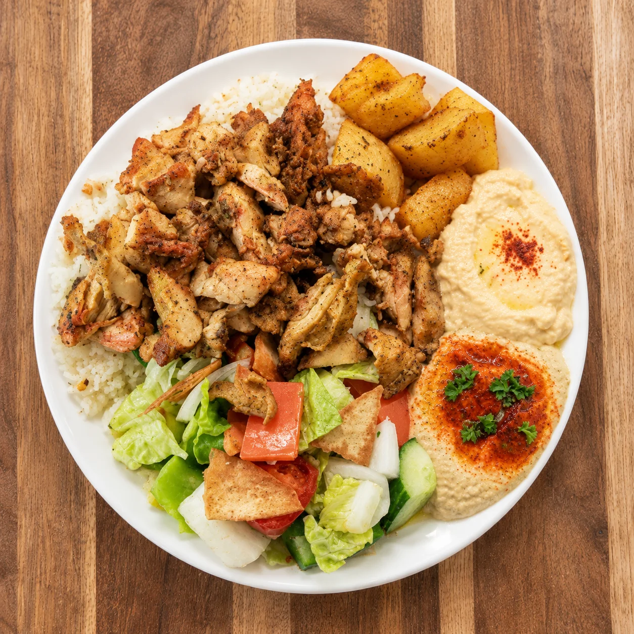 Sliced halal chicken shawarma with garlic sauce and pickles at Shawarma Grill, Centre Avenue East, Airdrie